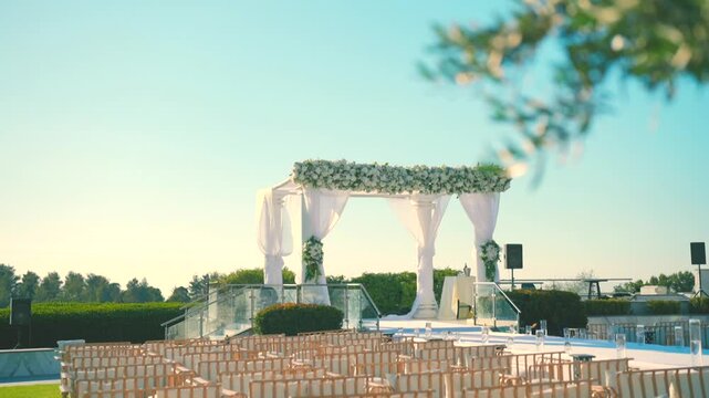 A beautiful white canopy with white flowers on the wedding day. High quality FullHD footage