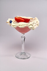 Delicious Dessert Cocktail with Whipped Cream and Fresh Strawberries in a Elegant Glass Serving