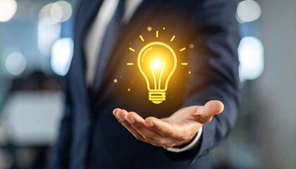 3D scene with a lightbulb-shaped idea icon floating above the hand of a blurred man in a suit