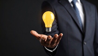 3D scene with a lightbulb-shaped idea icon floating above the hand of a blurred man in a suit