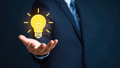 3D scene with a lightbulb-shaped idea icon floating above the hand of a blurred man in a suit