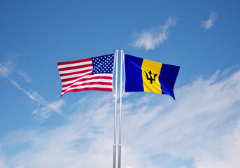 flags of  barbados and United States of America over blue sky background.