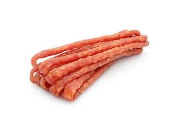 Dried cured sausages, thin salami sticks, cabanossi or kabanosy isolated on white background
