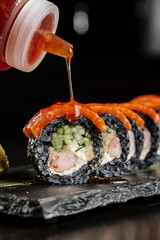 Drizzling Sauce Over Sushi Roll