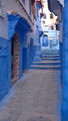 Alley with blue walls and steps in the medina in Chefchaouen, Morocco