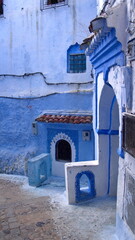 Corner with a door in an alley in the medina in Chefchaouen, Morocco