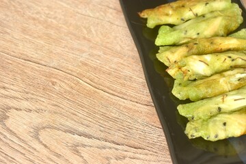 soft fresh coconut crepe topping black sesame Thai sweetmeat arranging on plate