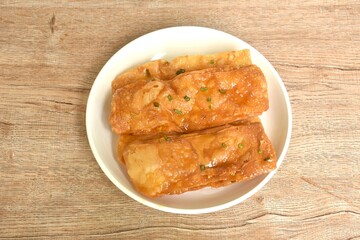 fried crispy sweet southern flat bread or roti dressing sweetened condensed milk on dish