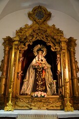 Obraz premium Cadiz, Spain 03.26.2019: The altarpiece of the Virgin of Carmen, in the Church of Santiago
