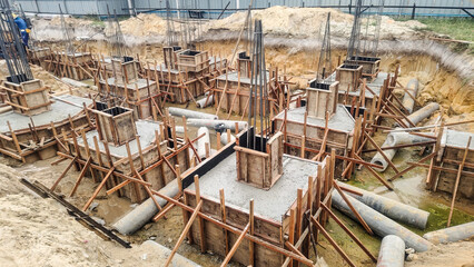 Reinforced Concrete Foundation Work – Construction Site with Column Starter Bars and Formwork