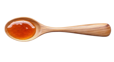 Golden honey glistening on wooden spoon, perfect for culinary creations and natural sweetness