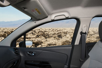 Car window view of Devil's Golf Course, Death Valley, USA
