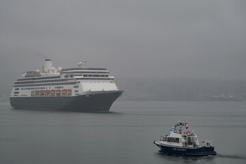 Classic cruiseship cruise ship liner Zaandam arrival into Vancouver, Canada port on grey foggy...