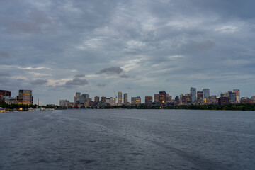 Boston skyline at dusk over the Charles River.