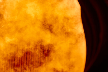 Intense combustion flames inside a steam boiler furnace at a thermal power plant during operation