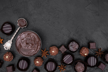 chocolate cocoa and various chocolatey dessert with black background 