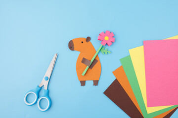 Capybara paper cutout with flower for DIY kits, toy companies, children products, early education centers, teacher aids, paper goods brands, handmade greeting card producers,