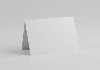 Blank white folded card standing up isolated on white background