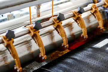 Innovative glue-spreading rollers at a cardboard box manufacturing plant enhance productivity...