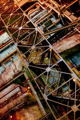 Industrial architecture showcasing complex pipe systems and structural elements in a manufacturing...