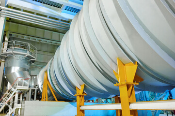 Flue gas duct installation process in a modern industrial facility during day hours