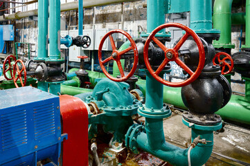 Industrial water pumping station with valves and machinery in operation at a facility