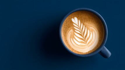 Cup of cappuccino with latte art in a blue mug on a dark background. Fresh coffee, barista art, morning energy, and café inspiration