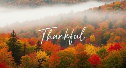 Beautiful autumn mountain forest with vibrant fall colors and morning mist featuring "Thankful" text overlay. Perfect for Thanksgiving and gratitude themes.