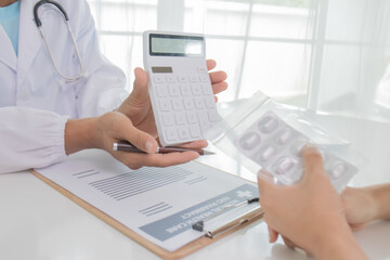 Fototapeta premium Young Asian male doctor consults teenage patient in hospital, explains diagnosis, prescribes treatment and gives advice with trust and expertise in hospital.