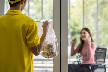 Delivery man in uniform deliver dessert to happy office worker