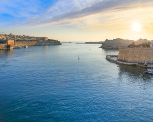 Sunrise view of Grand Harbour seascape in Valletta, capital of Malta. View of Fort St. Angelo, a bastioned fort in Birgu, located at the centre of the Grand Harbour. 