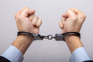 The restriction of freedom, hand, handcuffs, arrest and detention