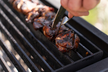 Cooking delicious pork on a hot summer day