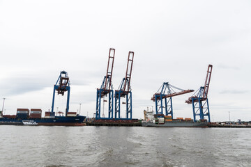 big blue cranes in the harbour of Hamburg Germany 