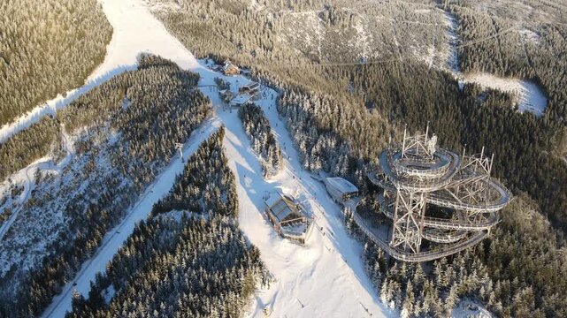Drone video of the winter ski resort of Doln&iacute; Morava, Czech Republic. Aerial footage of the snowy winter landscape, forests and ski slopes.