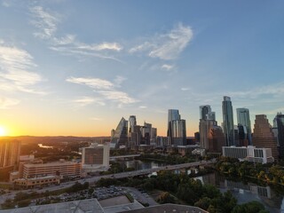 Fototapeta premium Beautiful Austin skyline during sunset with a stunning aerial drone view 