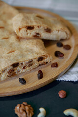 Deliciously Homemade Pastry Filled with Nuts and Dried Fruits, Perfect for Snacking or as a Dessert, Showcasing a Flaky Texture and Rich Flavor