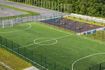 Open city sports grounds for playing football, stadium, weight training equipment, top view,...