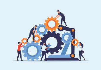 A team of people collaboratively building a large mechanism by fitting together interlocking gears.