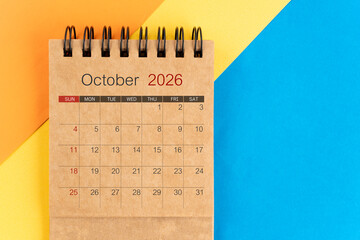 October 2026 brown color mini calendar on colorful background.