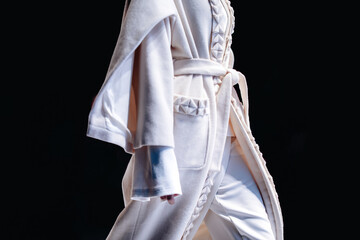 Autumnal women fashion,white cozy outfit on black background.