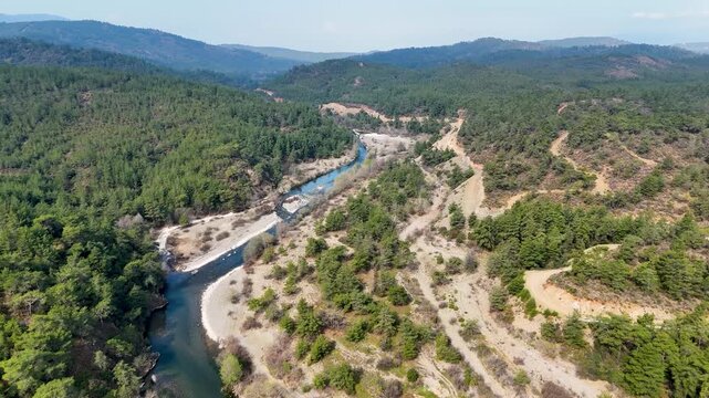 Aerial view of Nam Nam stream winding through forested mountains in Mugla, Mediterranean Turkey.