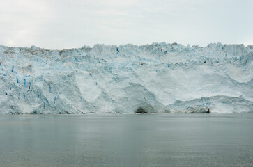 Summer on Greenland's west coast reveals icy fjords, glowing midnight sun, whales gliding through...