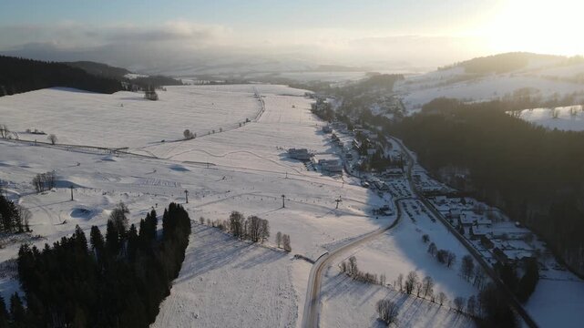 Drone video of the winter ski resort of Doln&iacute; Morava, Czech Republic. Aerial footage of the snowy winter landscape, forests and ski slopes.