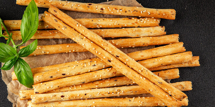 Grissini breadsticks whole grain cereal fresh delicious gourmet food background on the table rustic food top view copy space