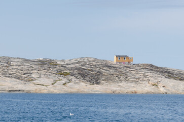 Summer on Greenland's west coast reveals icy fjords, glowing midnight sun, whales gliding through...