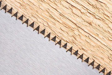 Saw blade on wood texture background. Close up of saw blade.