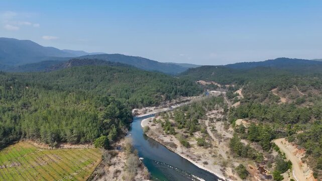 Aerial view of Nam Nam stream winding through forested mountains in Mugla, Mediterranean Turkey.