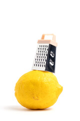 Lemon and grater on white background. Isolated.