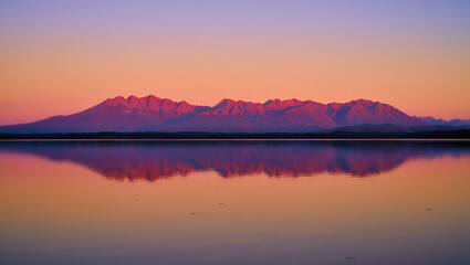 Naklejka premium Sunrise and sunset over calm lake with beautiful sky and reflections